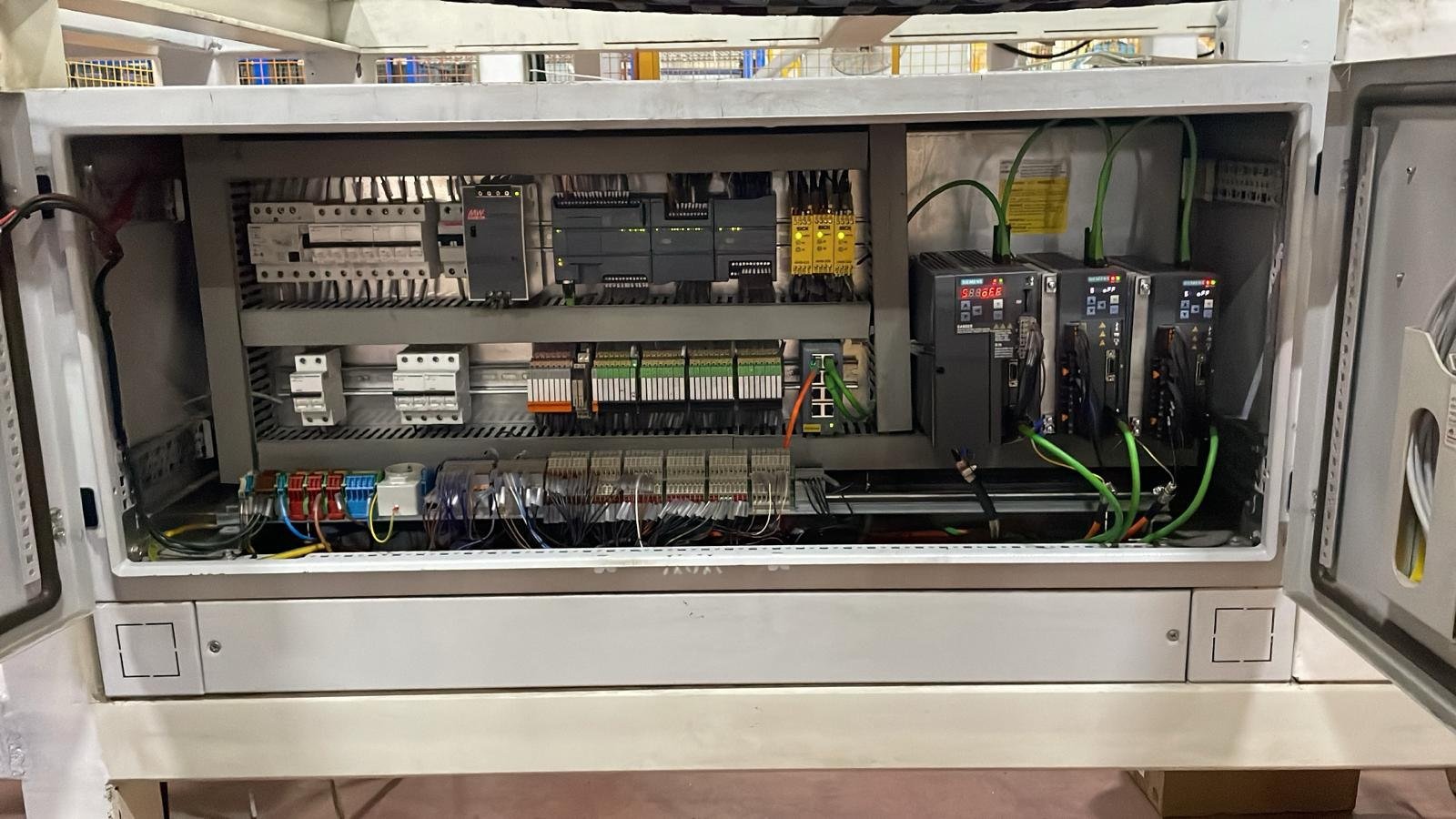 Overall view of the machine control cabinet and automation components